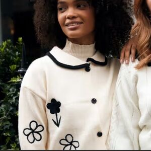 Chic White Cardigans with Black Floral Accents